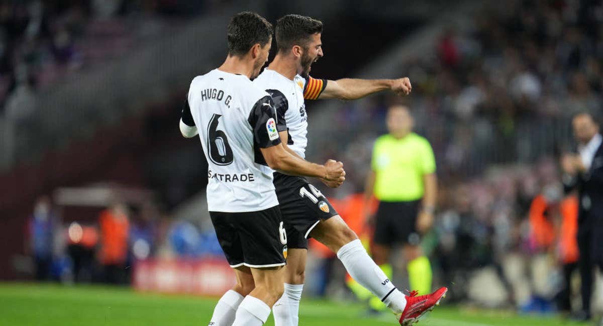 Gayà y Guillamón celebran un gol.
