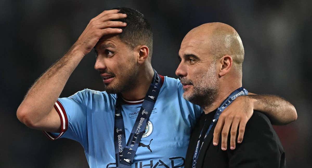 Rodrigo y Guardiola, tras la final de la Champions./REUTERS